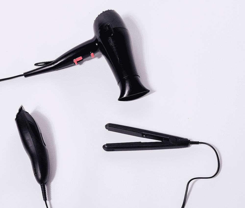 Hairdryer and straightener on a white background.